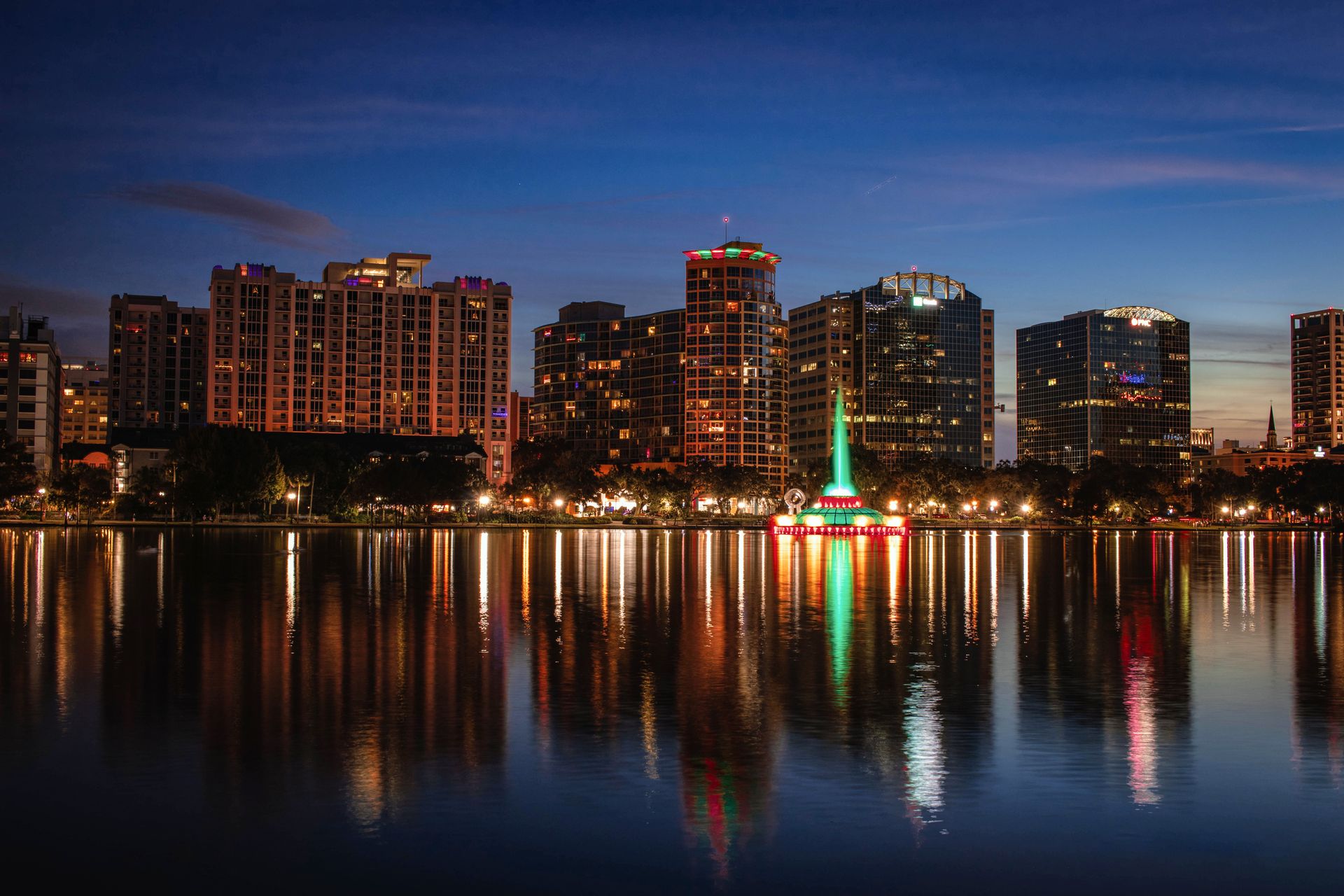 Downtown Orlando skyline at twilight over Lake Eola